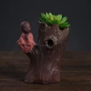 Tree trunk flower pot