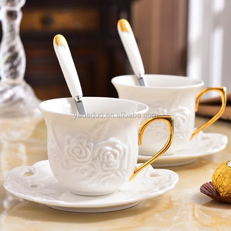 Elegant White Embossed Floral Ceramic Tea Cup With Gold Handle