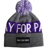 Pom pom wool beanie custom letters jacquard logo beanie with woven label on the cuff