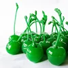 canned pitted green cherry with stem in heavy syrup