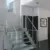 Top level frameless glass railing u-shaped staircase