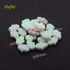 Fire White OP17 Hamsa Synthetic Opal On Sale