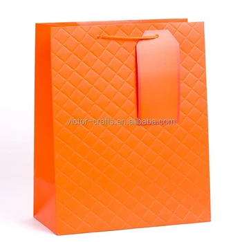 orange quilted purse