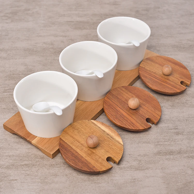 Hot sale kitchen used white ceramic spice pots seasoning pot spice jar with wood stand   .jpg