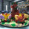 China direct manufacturer theme park rides kiddie games dinosaur style 16 seats rotary coffee cup carousel for sale