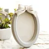 Light design 3d bow resin oval 12x8 photo frame