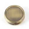 5cm across on the exterior Antique Brass Round Pill Boxes with 3 sections of a plastic insert that opens with a push button and