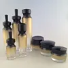 Hot sale 30g 50g 100g cosmetic glass packing amber jar, 30 ml and 50 ml 100ml 120ml blue purple glass cosmetic bottle