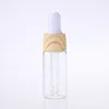 5ml 10ml 15ml 20ml glass pull dropper bottle with wood grain cap