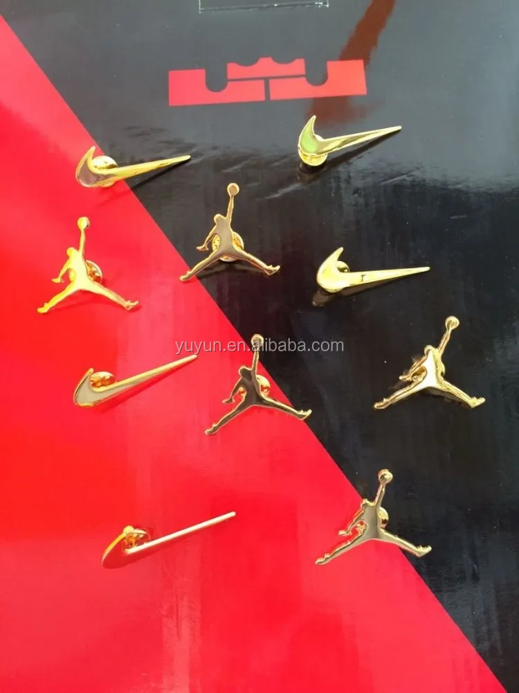 nike gold pins