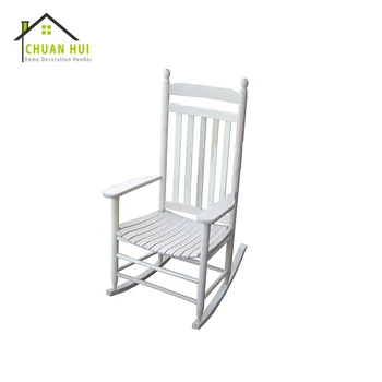white wooden rocking chair nursery