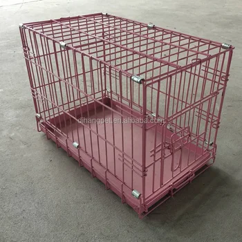 small pink dog crate