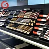 Cosmetic shop make up products display rack design for sale