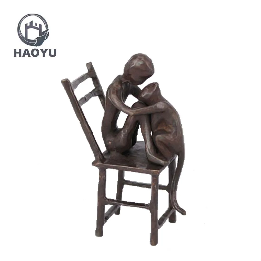 boy and dog statues