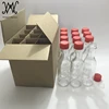 3oz clear glass woozy bottles for hot sauce with red caps shrink bands 12 pack