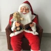 Hot sale Christmas plastic and fabric sitting Santa with sofa with moving and music