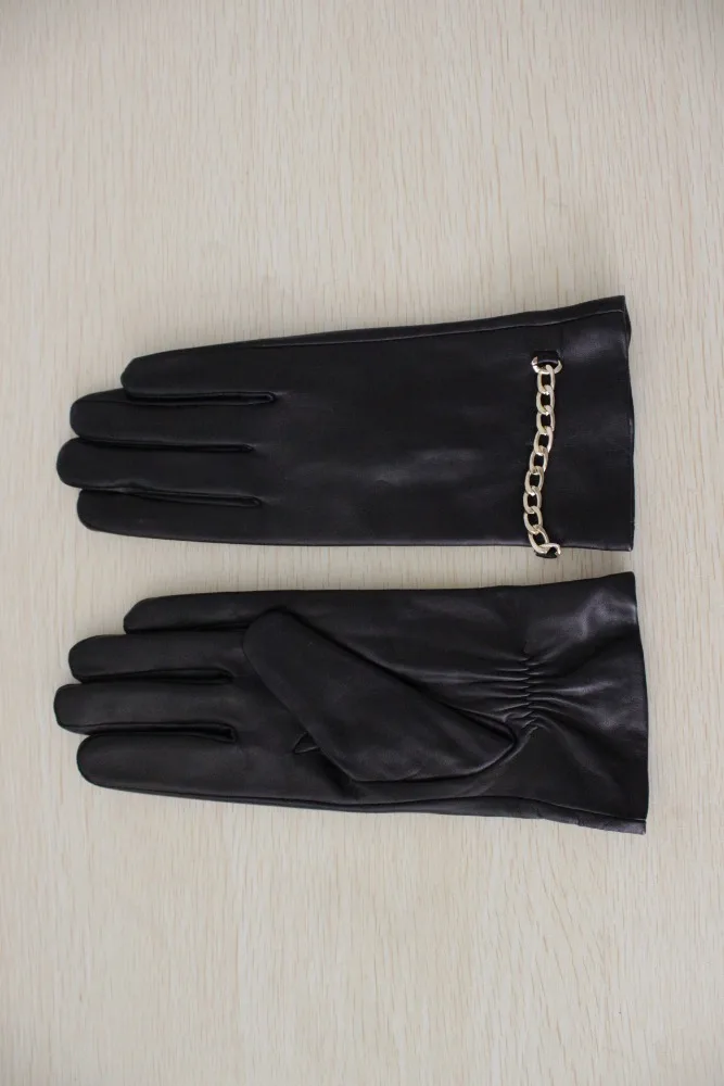 Lady's African leather gloves with metal chains