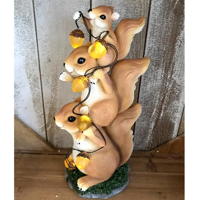 Resin Stacked Squirrel Holding Acorn Led Solar Powered Led Light - Buy