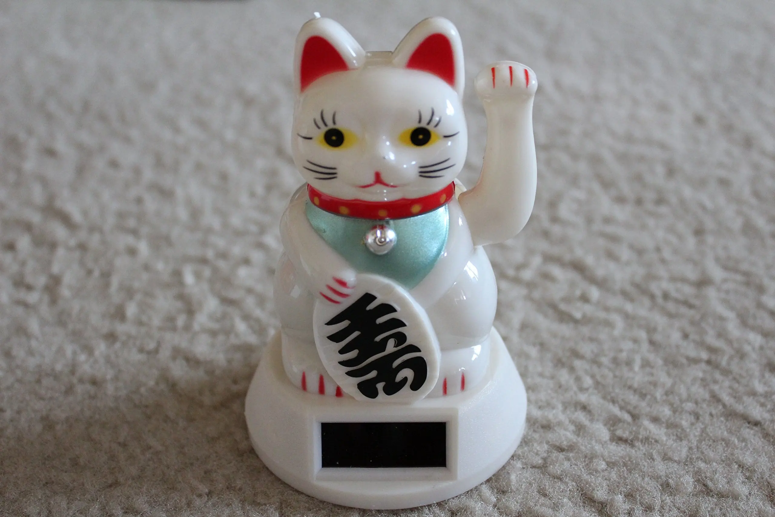 japanese cat with paw up