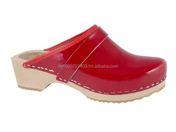 red patent leather clogs