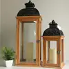 Teak-colored top metal pattern design wooden lanterns can be equipped with electronic candles