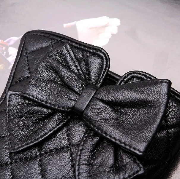 women's quilting seam back leather gloves with bow details
