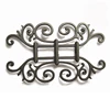 Decorative cast iron rosettes for fence and gate