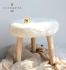 The cute plush decorated stool,window display