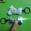 Custom advertising motorcycle shaped PVC push light keychain
