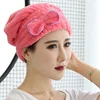Women use reusable turban towel shower cap bath