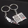 book and pen couple key ring for sale
