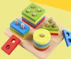 Colorful wooden geometric Sorting and stacking blocks on board