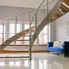 open riser indoor modern residential curved stairs with timber step