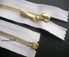 WHITE ZIP/ METAL GOLD TEETH OPEN ENDED.Different Sizes