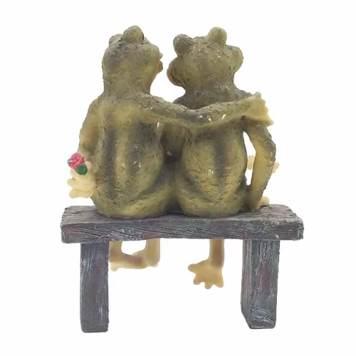 frogs on a bench garden statue