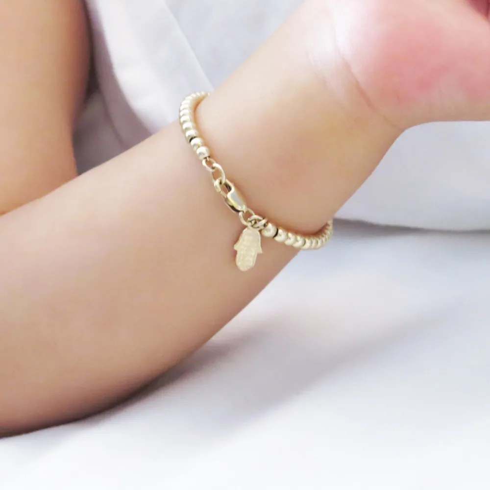 Золотые браслеты на руку с подвесками