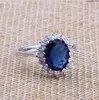 Wholesale 18K Gold ring with dark blue stone .