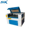 China CO2 laser engraving knife and honeycomb table laser cutting machine for shell coconut shell cloth etc non-metal