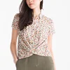 Lady's Romantic Combination of a Floral Pattern and a Wrap Look Allover Printed Blouse