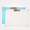 Fancy white blue cardboard clipboard with gold metal edge stripe background