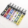 Cute Design Custom Silk Screen Printing Smile Face Logo Colorful Safety Woven Bracelet Key chains for Gifts