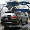 Dual swing arm water jet car washing machine