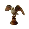 The living room is decorated with a vintage majestic eagle statue craft jewelry box