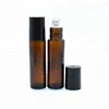 Essential oil pharmaceutical clear 10 ml roller bottle 10ml amber glass roll on bottle with metal roll on ball and black cap