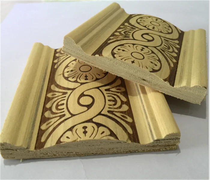 embossed white baseboard wood moulding