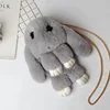 A hot fashion lady with a single shoulder and shoulder bag fur fur stuffed animal rabbit backpack students.