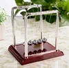 Newtonian pendulum billiard elastic impact ball physical energy conservation pendulum