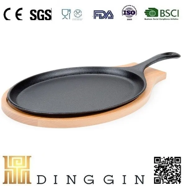 https://sc01.alicdn.com/kf/HTB1rhx4RXXXXXbfXpXXq6xXFXXXC/preseasoned-cast-iron-fajita-pan-with-wooden.jpg