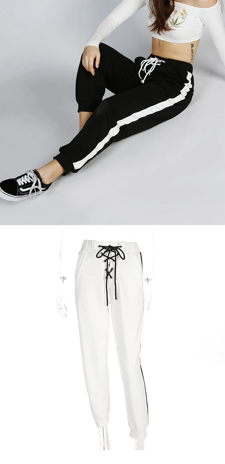 women's black track pants with white stripe