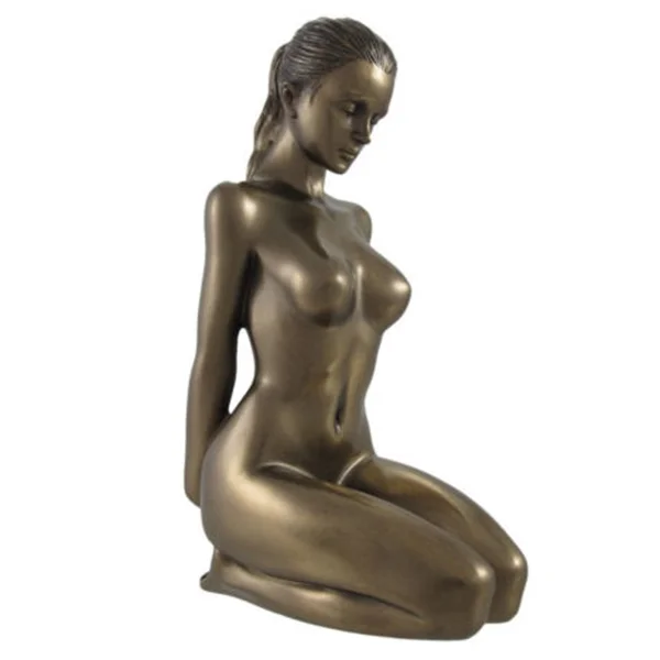 Bronze sculpture of a kneeling female nude